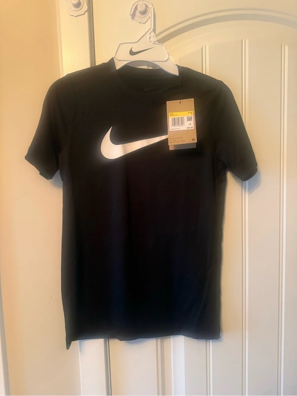 NEW WITH TAGS. Nike Black Short Sleeve Tee with White Swoosh.